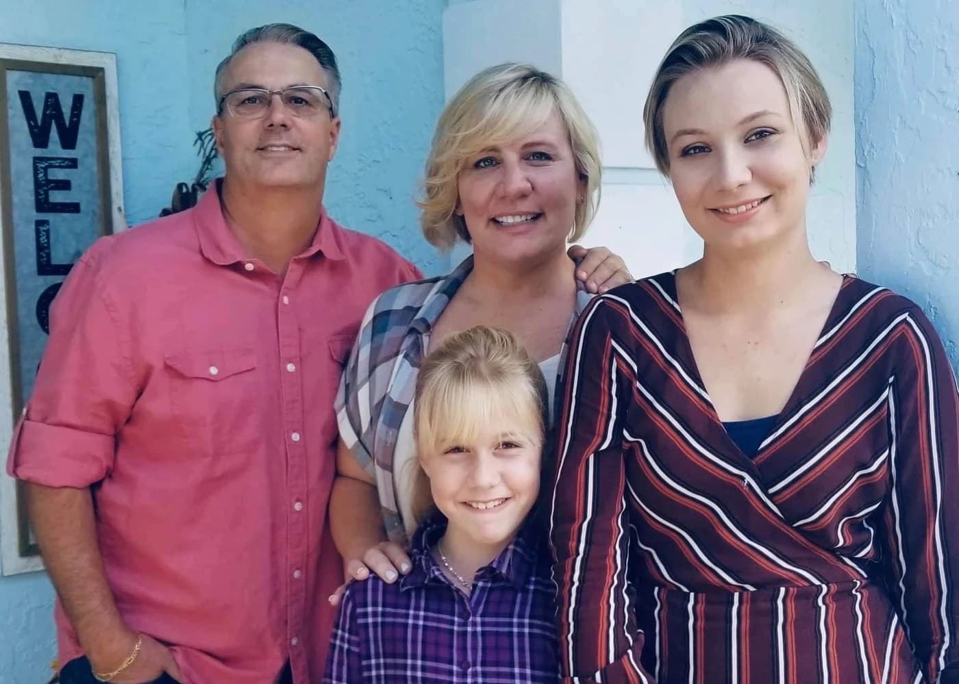 The Carr family — Don, Dorothy, Savannah, and Leah — outside their Palm Beach County home
